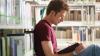 A man studying in the library