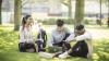 Young adults sitting on the grass